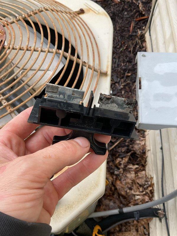 Completed annual cooling maintenance on 2019 air conditioning system. Updated customer contact information in system. Inspected outdoor condenser unit and identified heavily corroded electrical terminals on capacitor showing significant rust and oxidation buildup. Documented condition of corroded components and rusted fan guard assembly with photographic evidence for customer records and future service reference.