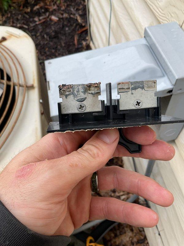 Completed annual cooling maintenance on 2019 air conditioning system. Updated customer contact information in system. Inspected outdoor condenser unit and identified heavily corroded electrical terminals on capacitor showing significant rust and oxidation buildup. Documented condition of corroded components and rusted fan guard assembly with photographic evidence for customer records and future service reference.