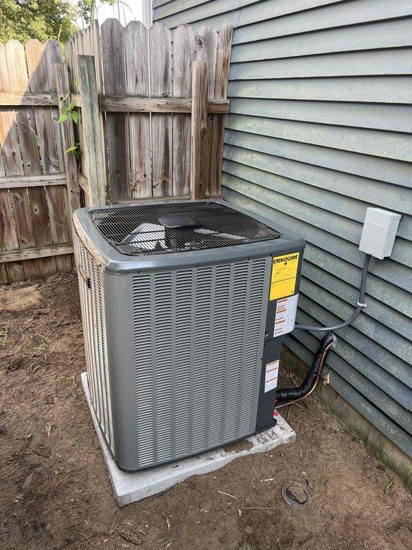Completed full HVAC system installation including new furnace and air conditioning condenser unit. Installed outdoor AC condenser on concrete pad with proper refrigerant line connections to residence, mounted electrical disconnect, and ensured adequate clearances from fence and siding. Indoor furnace unit installed on platform in basement with new air handler, plenum assembly, and flexible ductwork connections. Ran PVC condensate drain lines with proper pitch and termination. Verified all electrical connections, tested system operation, and confirmed proper airflow throughout. System commissioned and left in full working order.