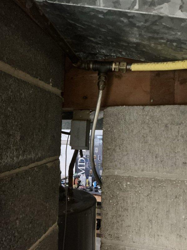 Conducted comprehensive sales estimate for replacement of 16-year-old furnace and air conditioning system in residential basement location. Documented existing Lennox furnace installation, including current ductwork configuration, gas line connections with yellow flexible supply line and black pipe fittings, and PVC venting system. Photographed equipment condition, surrounding infrastructure including concrete block foundation walls, structural support beams, and utility area layout to assess installation requirements and access considerations for future system replacement.