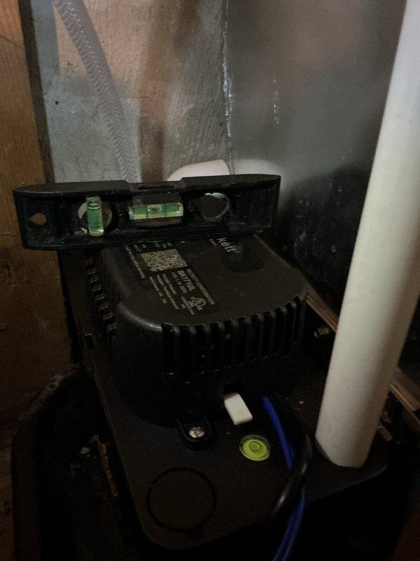Responded to no cooling call following new installation. Upon arrival, found condensate pump improperly installed and not level, preventing proper drainage and causing system safety shutdown. Leveled and repositioned condensate pump unit on basement floor to ensure proper operation. Verified pump functionality and confirmed system returned to normal cooling operation. Unit now operating as designed with proper condensate removal.