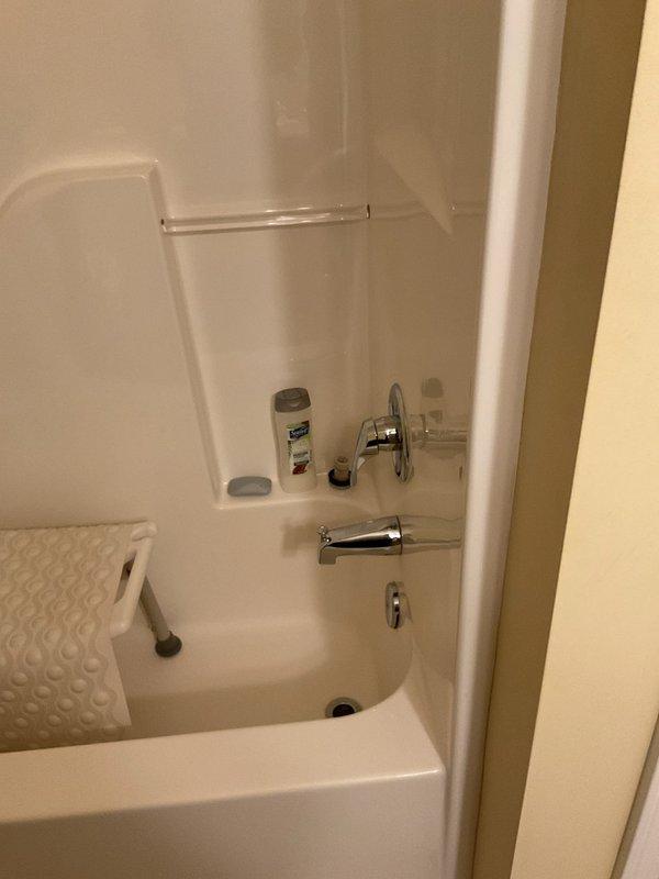 Responded to service call for multiple plumbing issues including dripping bathtub faucet and leaking toilet tank. Inspected bathtub faucet assembly and identified worn valve components causing continuous drip. Disassembled faucet, replaced deteriorated washers and seals, and reassembled unit to restore proper shut-off function. Examined toilet tank for source of leak and inspected internal flush mechanism. Checked flapper chain for proper length and adjustment to ensure complete seal when tank refills. Made necessary adjustments to chain tension and verified flapper seats correctly against flush valve. Tested all repairs for proper operation and confirmed no active leaks present at completion.