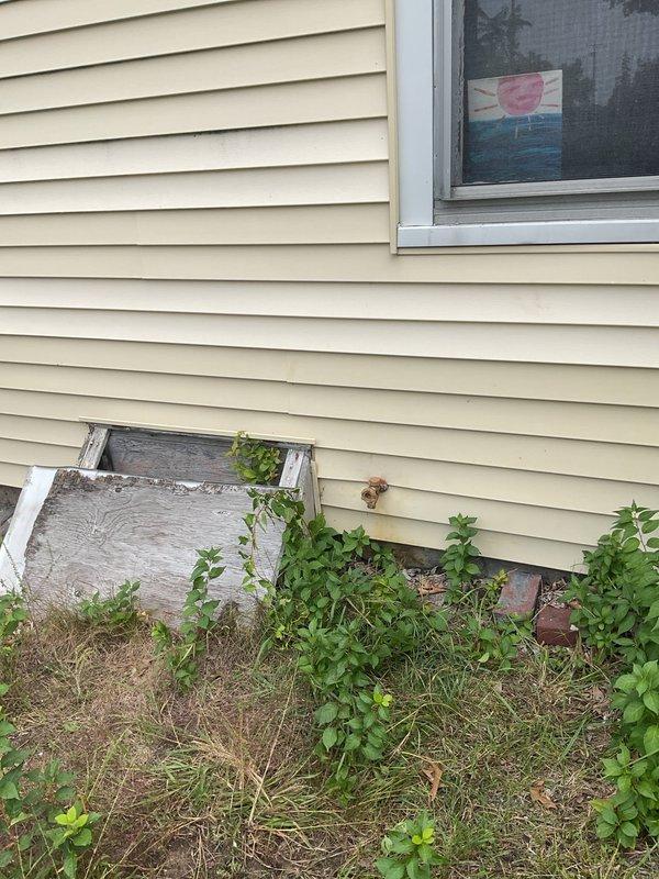 Completed hose bib replacement on residential property. Accessed exterior faucet through crawl space beneath house, removed deteriorated existing hose bib fixture, and installed new frost-free hose bib with proper drainage and secure mounting to foundation wall. Verified all connections for leaks and confirmed proper operation of new fixture.