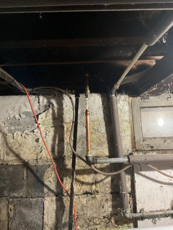 Completed hose bib replacement on residential property. Accessed exterior faucet through crawl space beneath house, removed deteriorated existing hose bib fixture, and installed new frost-free hose bib with proper drainage and secure mounting to foundation wall. Verified all connections for leaks and confirmed proper operation of new fixture.