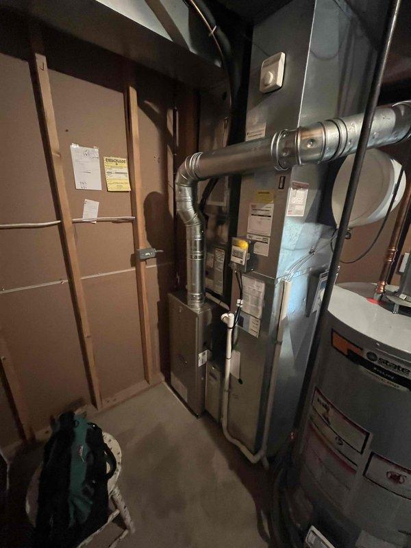 Completed full HVAC system installation including new furnace and air conditioning unit in basement mechanical room. Installed air handler with integrated humidification system, configured ductwork connections, and verified proper placement of all equipment according to manufacturer specifications. All components tested and operational upon completion.