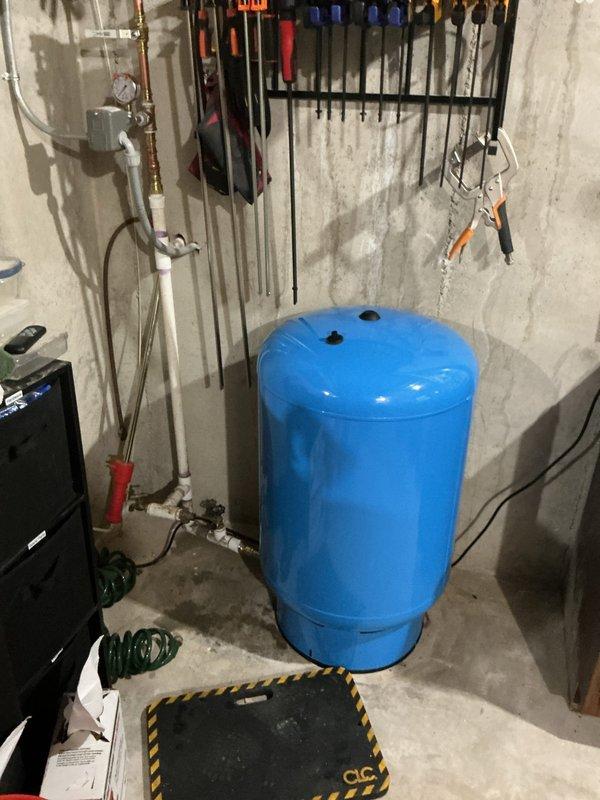 Completed comprehensive plumbing system upgrades including replacement of sewage ejection pump system with new pump, check valve, and sealed lid. Installed X-Tall Kohler comfort height elongated toilet in downstairs bathroom. Replaced existing well tank with new 44-gallon pressure tank to improve water pressure throughout the home. Installed new brushed nickel bathroom faucet to ensure optimal water flow and pressure delivery. All components tested and confirmed operational upon completion.