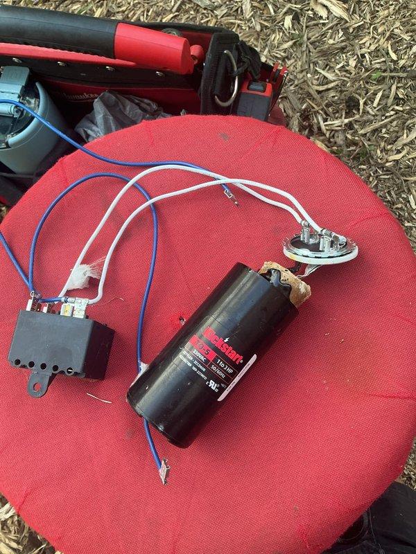 # NC-No Cool Service Completed

Responded to a no cooling call on an outdoor HVAC condensing unit. Upon arrival, performed diagnostic testing on the electrical system. Found failed run capacitor showing significant corrosion, surface deterioration, and electrical failure. Removed defective capacitor and associated components from the unit for testing and replacement. Installed new run capacitor with proper electrical connections to contactor and CoreSense monitoring system. Verified all wire terminations were secure and properly routed within the control panel. Tested system operation and confirmed unit returned to normal cooling function. Unit operating within manufacturer specifications at time of departure.