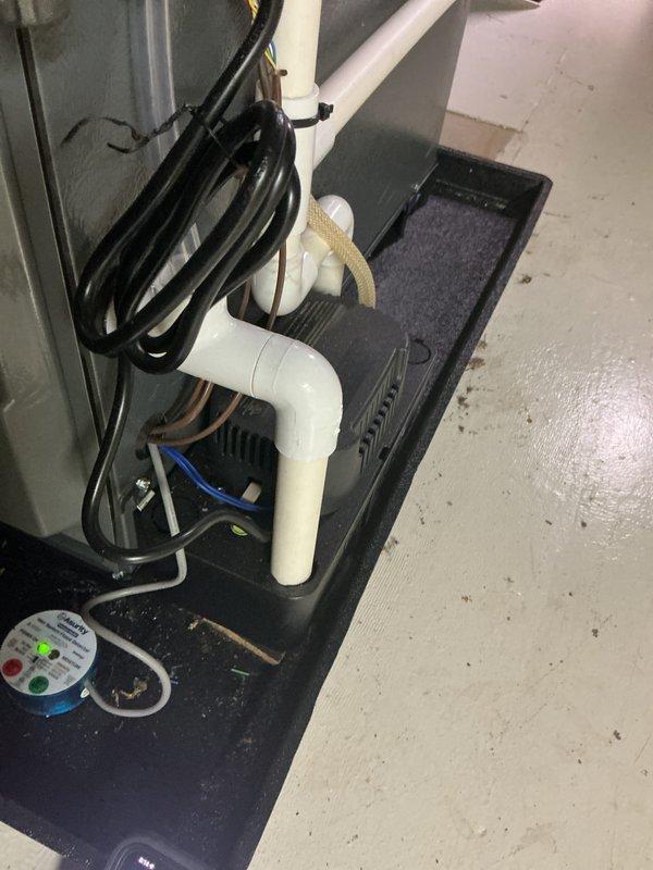 Completed annual cooling maintenance on EnergiAir system (Model WT 03-2035, installed 2023). Replaced heavily soiled air filter that showed significant accumulation of dust and particulate matter with visible compression damage to pleated structure. Inspected condensate drain system including PVC trap configuration and drain pan; confirmed proper drainage and no leaks present. Verified HVAC unit operation and documented equipment condition with photos. System operational upon completion.