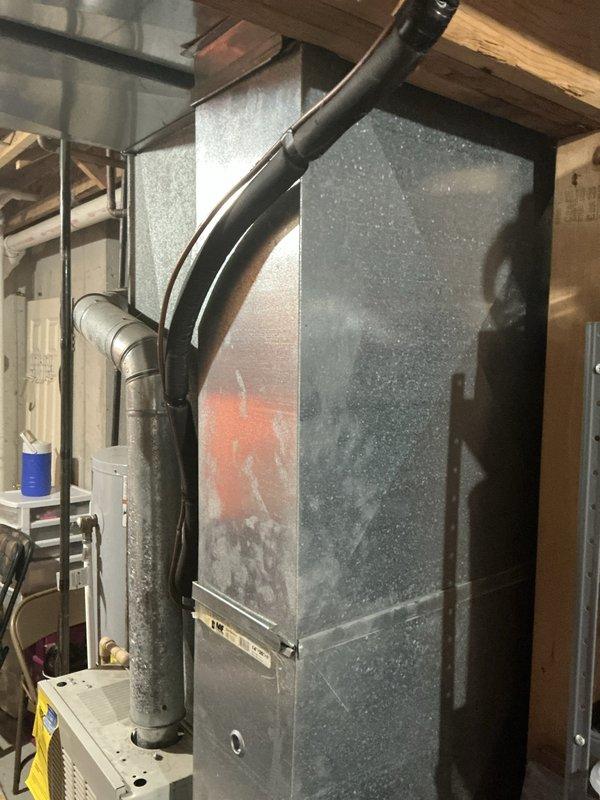 Completed estimate for replacement of 28-year-old non-functional air conditioning system and operational furnace in basement mechanical room. Customer requested both units be replaced simultaneously for system compatibility and efficiency. Documented existing equipment conditions including aged furnace with active combustion chamber, deteriorated ductwork, and associated HVAC components through photographic assessment for replacement proposal.