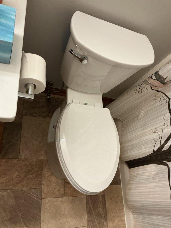 Completed toilet replacement following new flooring installation in residential bathroom. Removed existing toilet, installed customer-supplied unit, reconnected water supply line, tested for proper function and leaks, and ensured secure mounting to updated tile surface.