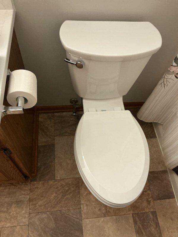 Completed toilet replacement following new flooring installation in residential bathroom. Removed existing toilet, installed customer-supplied unit, reconnected water supply line, tested for proper function and leaks, and ensured secure mounting to updated tile surface.