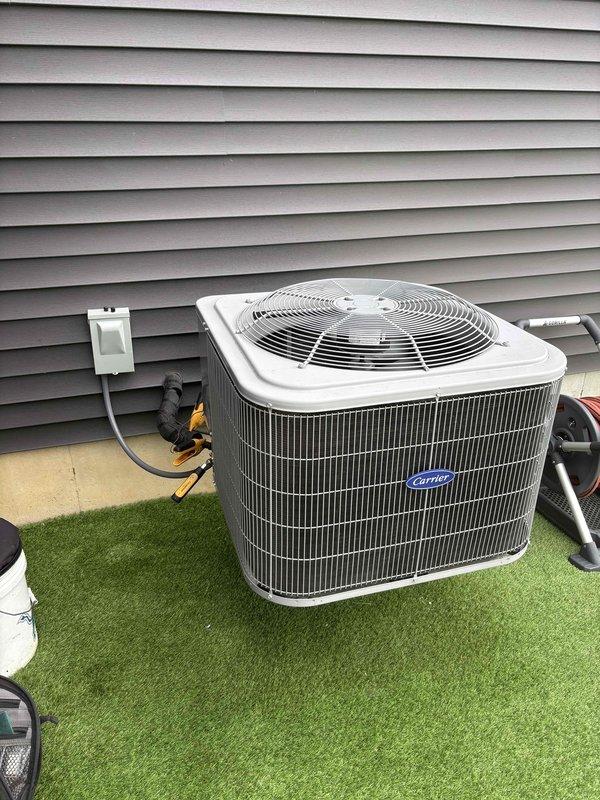 Completed annual cooling maintenance on Carrier outdoor condensing unit. Performed comprehensive system inspection including electrical testing with digital multimeter, recording amperage draw of 42.3 amps at compressor. Verified proper operation of dual-run capacitor and electrical components within disconnect panel, confirmed all wire connections secure and terminals tight. Unit operating within normal parameters with no deficiencies noted.