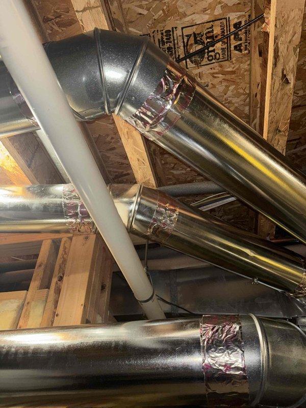 Performed complimentary indoor air quality assessment and documentation of existing HVAC ductwork installation in attic and basement areas. Inspected metallic ductwork runs, joint sealing integrity, and overall system configuration including 90-degree elbows and straight sections with foil tape applications. Photographed exposed mechanical systems for estimate preparation and future reference regarding potential duct sealing, insulation improvements, or air quality enhancement recommendations.