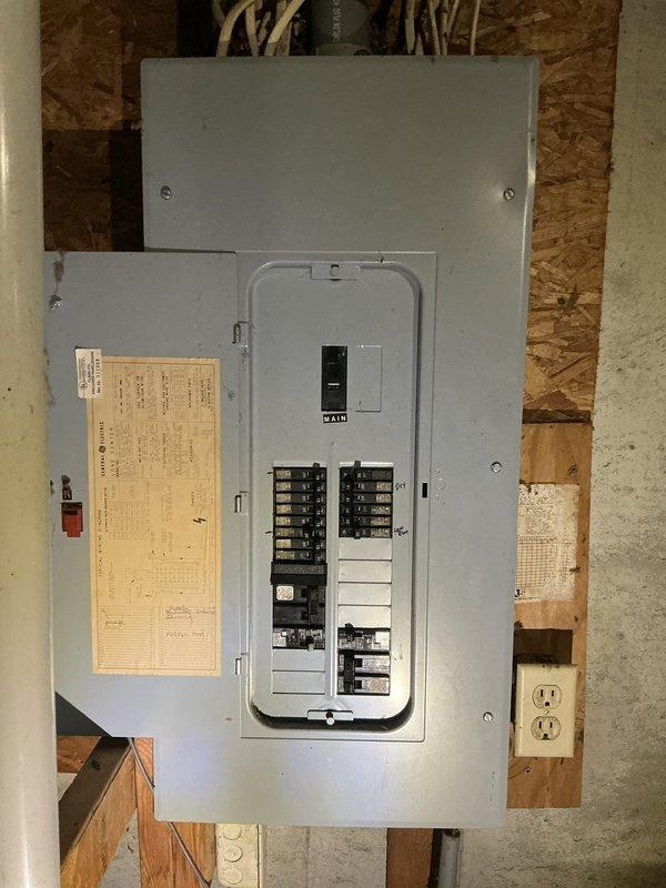 Conducted comprehensive estimate for furnace and air conditioning system installation in a 1988-built home requiring new AC addition. Assessed unfinished basement area with exposed mechanical systems, including existing electrical panel with available capacity for HVAC equipment, copper plumbing lines, and ductwork infrastructure. Evaluated electrical service panel for proper circuit availability and load calculations necessary for new equipment installation. Documented existing mechanical ceiling layout including copper piping, PVC drainage systems, and galvanized ductwork to determine optimal placement for new furnace and air conditioning components. Identified suitable installation location with adequate clearances and access to existing utility connections for efficient system integration.