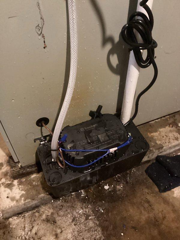 Responded to service call for AC unit with intermittent starting issues and inadequate cooling. Upon arrival, found condensate pump running continuously as reported. Inspected Energiair system and condensate removal equipment. Evaluated pump operation, drainage lines, and electrical connections. Documented existing condensate pump installation with photos showing unit mounted on basement floor with discharge piping and power supply. Based on field assessment and previous consultation notes, confirmed pump malfunction affecting system performance. Work completed as warranty service per prior authorization.