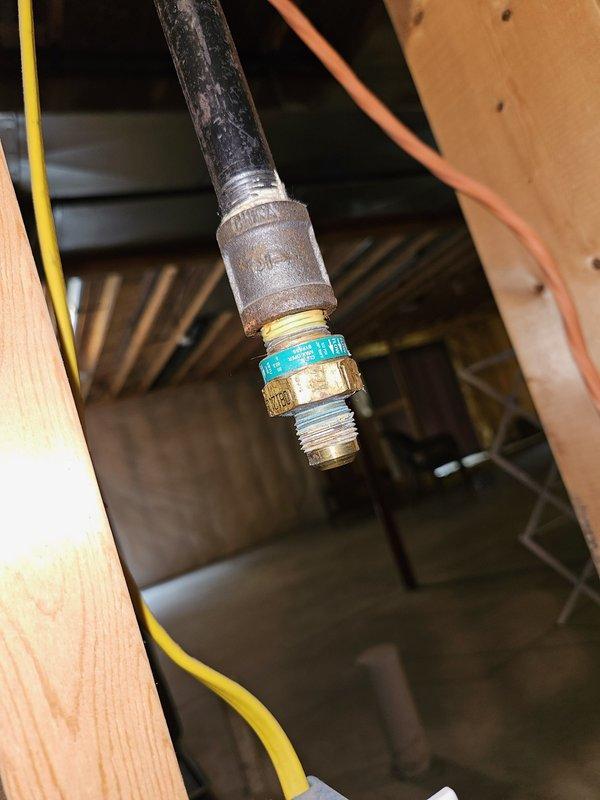 Responded to service call for plumbing repairs needed to pass inspection for senior assistance program. Applied appropriate thread seal tape (Teflon tape) to gas line connection in accordance with code requirements, using yellow tape rated for gas applications on the threaded brass fitting. Installed secure clamp on dryer vent ductwork to ensure proper connection and compliance with ventilation standards. All work completed in crawl space area, with gas line connections properly sealed and dryer vent secured to meet inspection requirements.