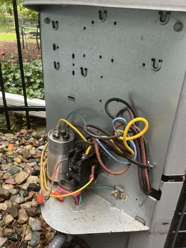 Installed a 5-2-1 compressor hard start kit on an outdoor HVAC unit to improve compressor starting performance and reduce electrical stress on the system. The installation involved mounting the start capacitor assembly and integrating it with the existing dual-run capacitor and compressor circuit wiring. All electrical connections were properly terminated and secured, and the unit was tested for proper operation.