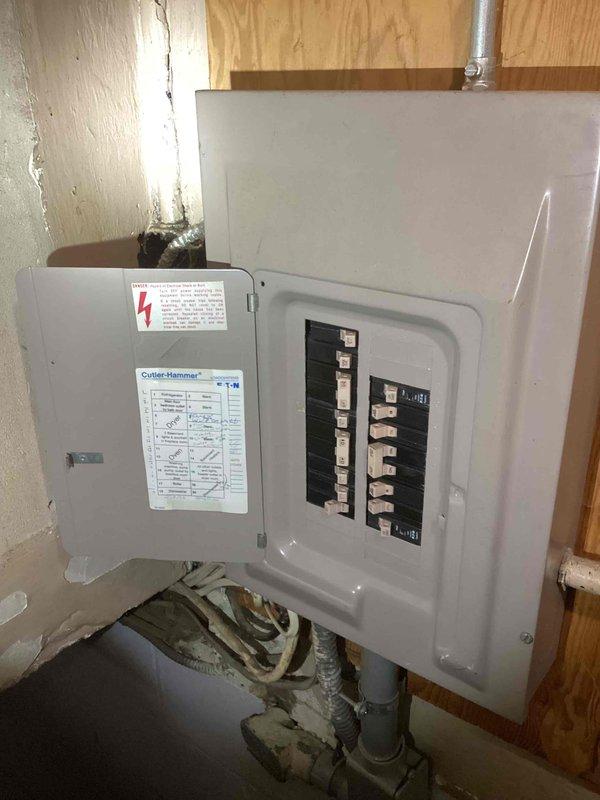 Conducted on-site assessment for mini split installation at residential property. Evaluated existing electrical infrastructure including main panel with dual-row breaker configuration and exterior meter assembly with disconnect box. Documented current electrical capacity and conduit routing to determine feasibility and requirements for new mini split system installation.