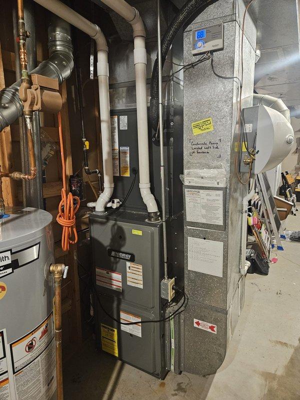 Completed full air conditioning system replacement at residential property. Installed new outdoor condensing unit on existing concrete pad with proper refrigerant line connections and electrical disconnect. Replaced indoor air handler in basement mechanical room with new unit featuring digital control panel. Verified all refrigerant lines, electrical connections, and ductwork transitions were properly secured and sealed. System tested and confirmed operational upon completion.