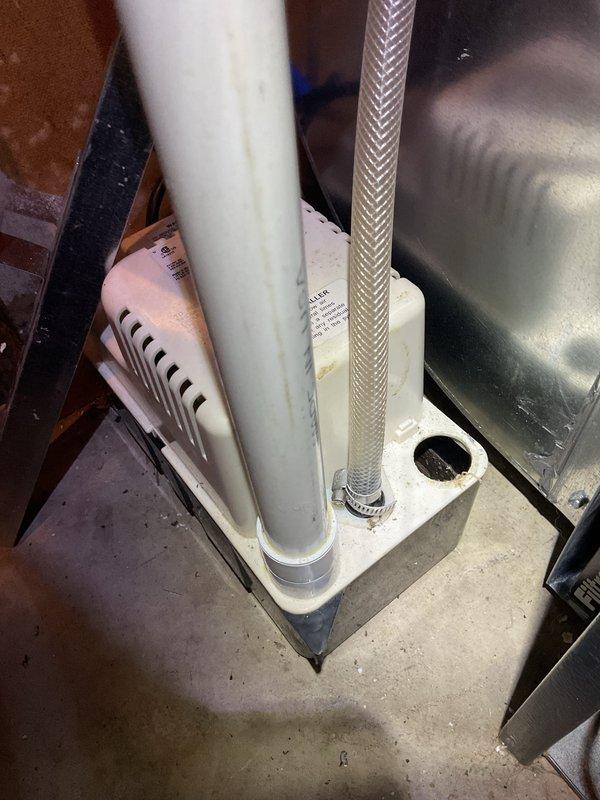 Completed comprehensive ASTU-AC Super Tune-up on dual EnergiAir systems (7-year warranties expiring 2028 and 2029). Performed full inspection of HVAC equipment including condensate drain pan, PVC drainage lines, and braided stainless steel flexible connections with secure hose clamps. Inspected vertical ductwork showing age-related oxidation and metal banding connections throughout basement installation. All systems tested and operational, with photo documentation captured for service records.