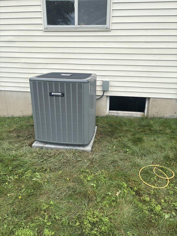 Completed full air conditioning system replacement at residential property. Installed new outdoor condenser unit on concrete pad with proper electrical disconnect and conduit connections. Unit positioned against exterior wall beneath window with appropriate clearances maintained. Indoor air handler installed in basement mechanical room, integrated with existing ductwork and ventilation systems using flexible duct connections. All electrical connections completed to code, system tested and verified operational upon completion.