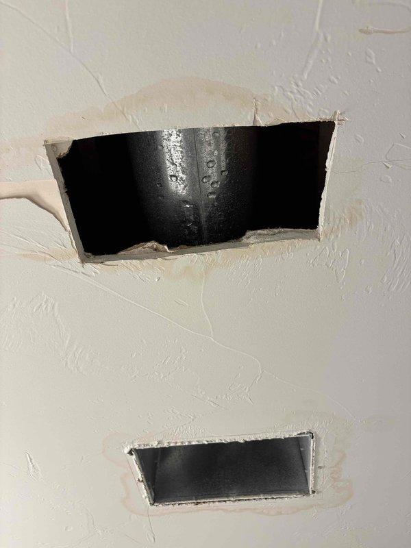 Responded to water leak complaint involving HVAC system and water heater. Upon inspection, identified active condensation leaking from both the HVAC unit and supply ductwork, which had caused visible drywall damage to surrounding ceiling and wall surfaces. Additionally, discovered condensation leaking from tubing connected to the water heater. Documented all affected areas with photographs showing compromised drywall with water damage, exposed PVC piping with visible moisture issues, and HVAC ductwork installation in attic space where condensation was occurring. Recommended proper insulation of ductwork to prevent future condensation, evaluation of drain line functionality, and drywall repair once moisture sources are addressed.