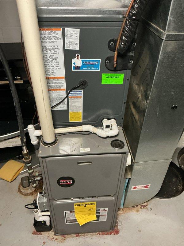 Completed annual cooling system maintenance and inspection on residential HVAC system. Performed comprehensive tune-up including filter inspection, refrigerant level check, electrical connection testing, condensate drain verification, and thermostat calibration. Documented equipment condition with photos showing Ruud furnace installation with proper venting and gas line connections. All components operating within manufacturer specifications with no deficiencies noted. System approved for continued operation through cooling season.