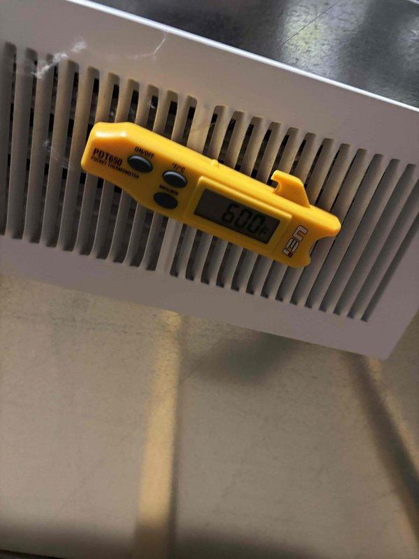 Responded to no-cooling complaint on 11-year-old residential air conditioning system. Upon arrival, confirmed unit was running but not producing adequate cool air at supply registers. Performed diagnostic assessment including temperature differential measurements at supply vents and visual inspection of outdoor condensing unit. Outdoor unit showed signs of age with moss and algae growth on surrounding landscaping, indicating potential maintenance concerns. Documented system conditions and measurements for further evaluation of refrigerant charge, airflow, and component functionality to restore proper cooling operation.