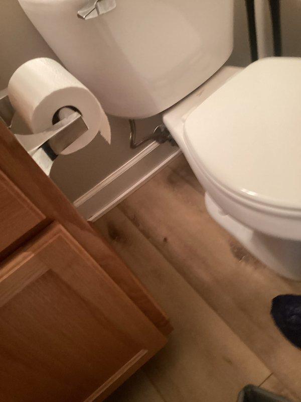 Responded to service call for two toilet issues: upstairs unit leaking from tank area and downstairs unit producing excessive noise during flush cycle. Inspected upstairs toilet tank components and identified leak source at tank-to-bowl connection. Inspected downstairs toilet flush mechanism and diagnosed worn fill valve causing loud water hammer effect. Documented internal tank components including fill valve assembly, flush valve, and float mechanism for both units.
