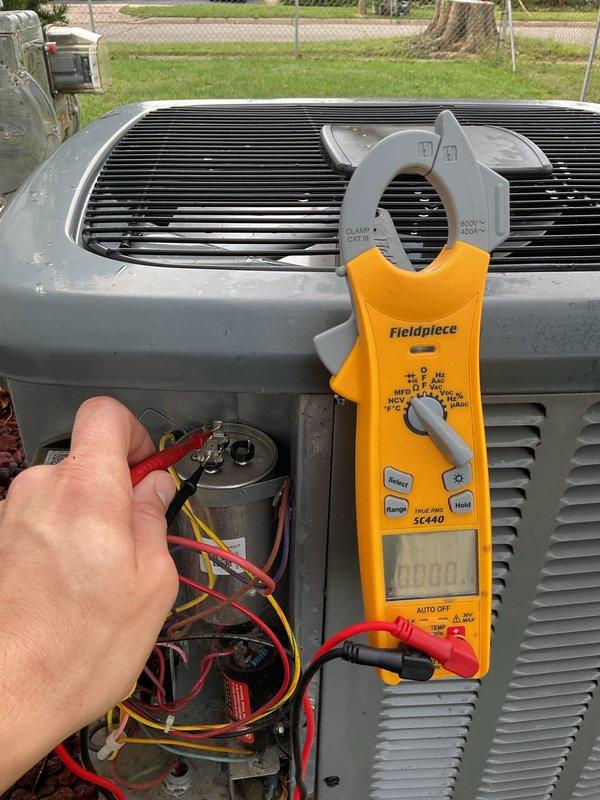 Completed annual cooling maintenance on EnergiAir system per 5-year tune-up agreement. Inspected attic-mounted air handler unit, verified proper ductwork connections and airflow. Performed electrical diagnostics on outdoor condensing unit using Fieldpiece SC440 meter, tested capacitor with proper test leads to verify component operation and electrical parameters within manufacturer specifications. System operating normally with all components functioning as designed.