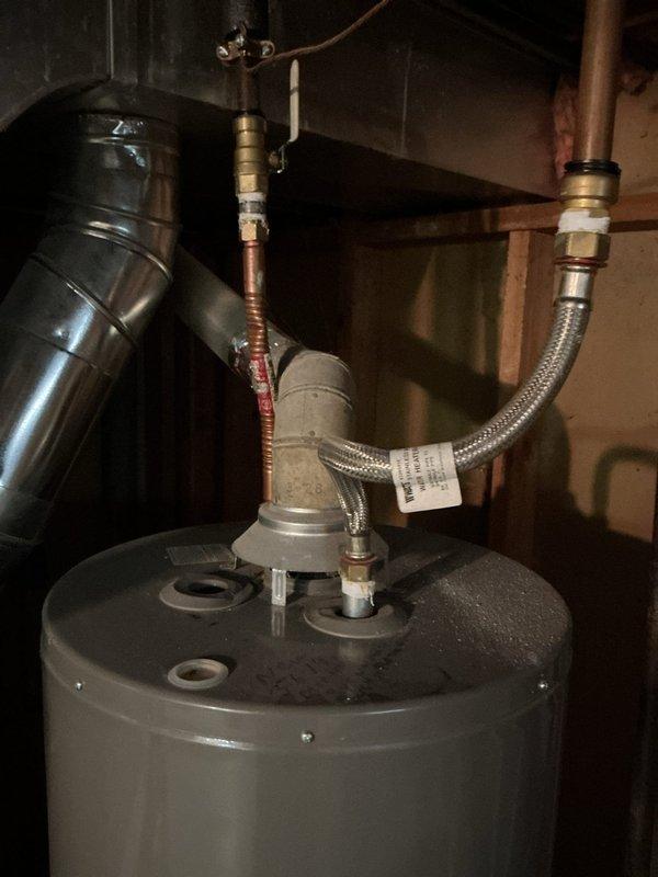 Completed annual heating maintenance on furnace and humidifier system per 2-year service agreement. Performed comprehensive tune-up including inspection of all heating components, burner assembly, heat exchanger, blower motor, and electrical connections. Verified proper humidifier operation and water supply connections. Inspected water heater plumbing connections and pressure relief valve assembly in utility area. All systems tested and operating within normal parameters upon completion.