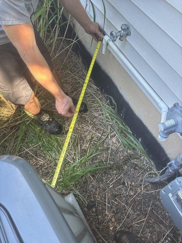 Responded to inspector correction regarding NFPA code violation for insufficient clearance between gas regulator vent and condenser unit. Measured and documented existing spacing between fixtures, confirming compliance with required 3-foot minimum clearance specification. Photographed gas meter assembly, piping configuration, and outdoor fixtures to provide verification of corrected installation for code compliance approval.