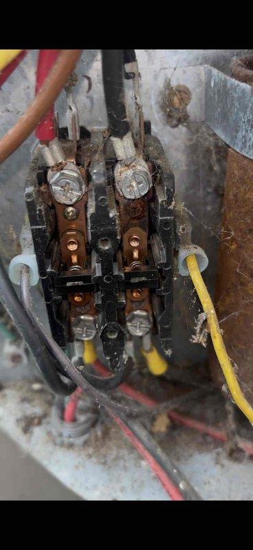 Completed annual heating and cooling maintenance on 3-year-old Bryant air conditioning system and 25-year-old Ducane furnace. Performed comprehensive tune-up on both units including filter inspection, electrical connection testing, and system diagnostics. Noted significant corrosion and rust on electrical terminal block assembly within furnace, with visible deterioration of wire connections and enclosure surfaces indicating moisture exposure over time. Documented equipment condition with photos for customer records. All systems operational at time of departure.