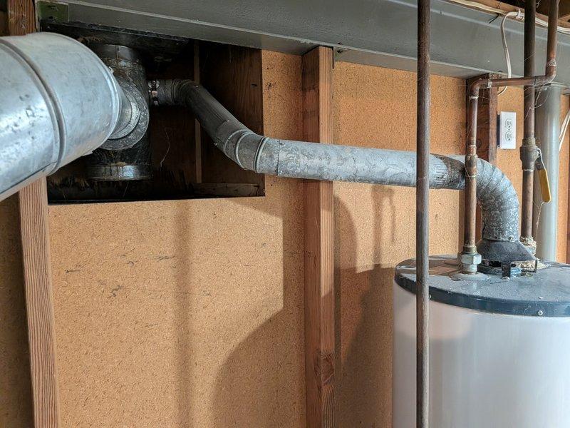 Provided estimate for water heater replacement in single-family residence with no hot water production affecting entire home. Evaluated 19-year-old existing unit installed in 2007 and documented mechanical utility area configuration including plumbing connections, venting system, and electrical requirements. Prepared comprehensive replacement proposal for company-supplied water heater with professional installation.