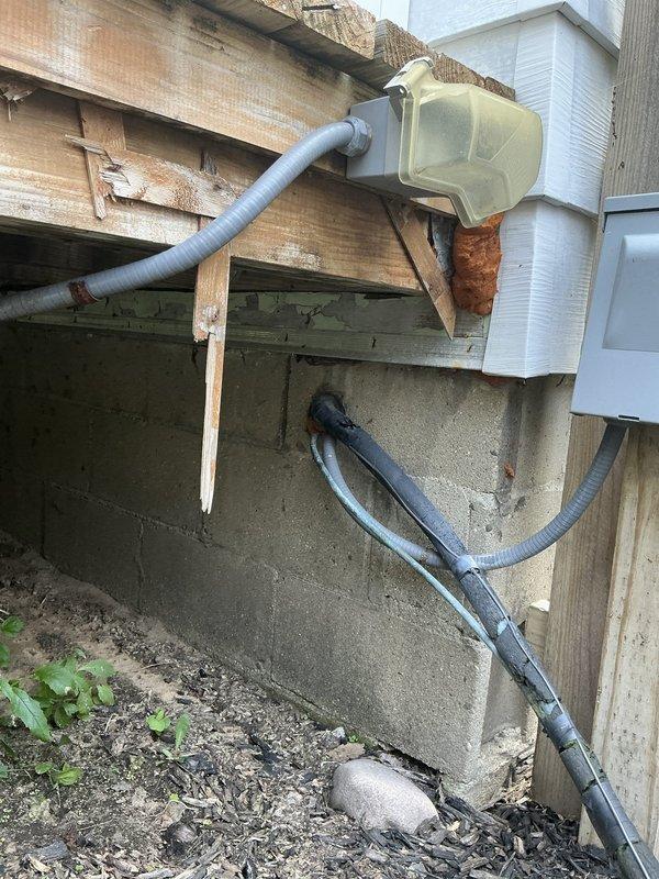 Completed comprehensive estimate for furnace and air conditioning system replacement with evaluation of equipment relocation requirements. Assessed existing Lennox condensing unit positioned on exterior mulch bed adjacent to wooden deck structure, documented current refrigerant line routing and electrical connections, and evaluated crawlspace foundation area where furnace repositioning is proposed. Identified potential need for plumbing coordination related to separate office work requirements.