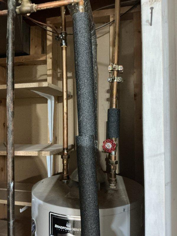 Provided estimate for replacement of existing 40-gallon gas-fired Bradford White water heater located in basement utility area. Assessed current installation including copper supply piping, foam pipe insulation, shutoff valves, and connections to existing HVAC system, documenting equipment specifications and surrounding workspace conditions for accurate replacement proposal.