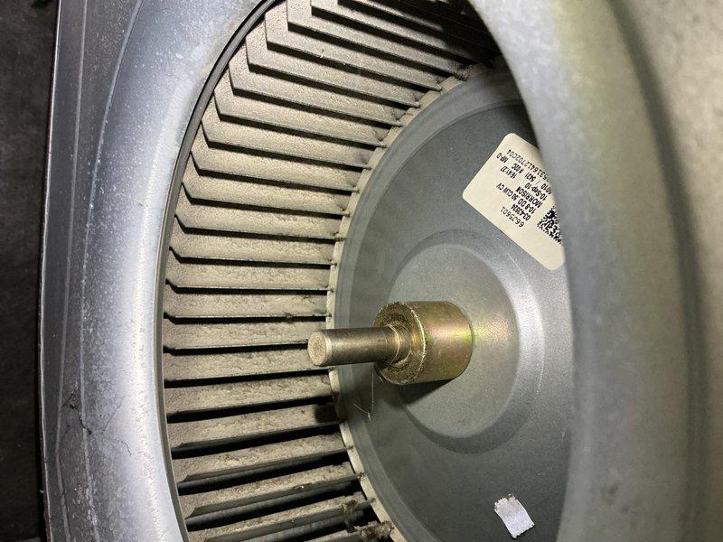 Completed annual cooling maintenance on 9-year-old Lennox system. Inspected blower wheel assembly showing normal dust accumulation on fins and housing, verified proper operation of condensate drainage system with pump and collection pan in place. All components operating within normal parameters for unit age.