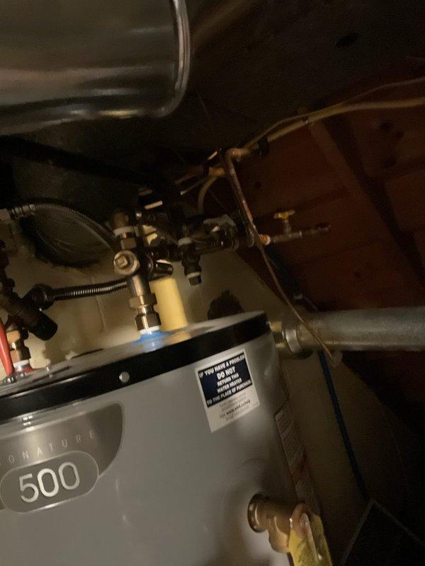 Responded to service call for non-operational air conditioning system affecting entire single-family residence. Performed comprehensive system evaluation of dual condenser units and documented existing equipment configuration including water heater and HVAC components. Provided estimate options for repair versus replacement to assist homeowner in determining best course of action for restoring cooling system functionality.
