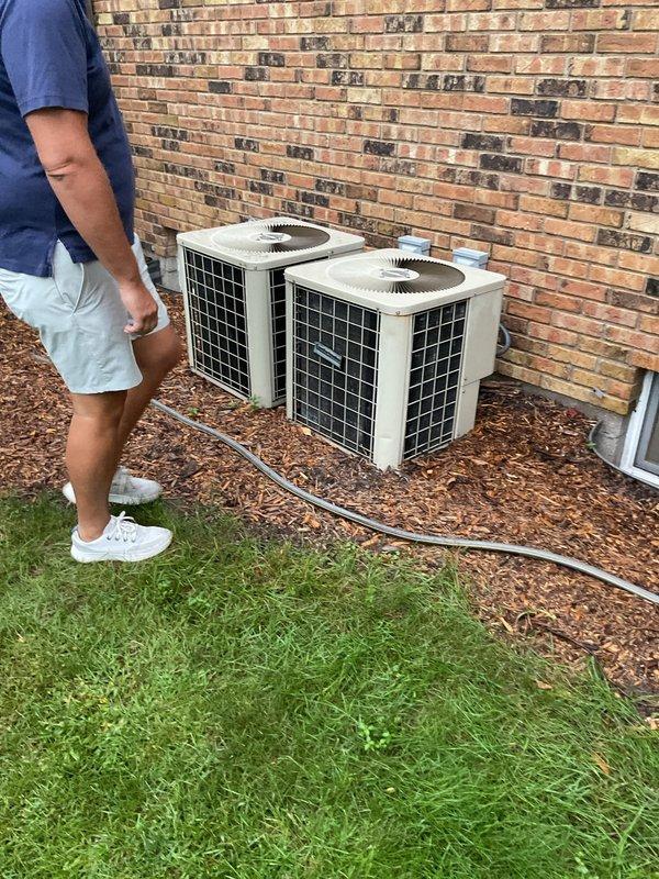 Responded to service call for non-operational air conditioning system affecting entire single-family residence. Performed comprehensive system evaluation of dual condenser units and documented existing equipment configuration including water heater and HVAC components. Provided estimate options for repair versus replacement to assist homeowner in determining best course of action for restoring cooling system functionality.