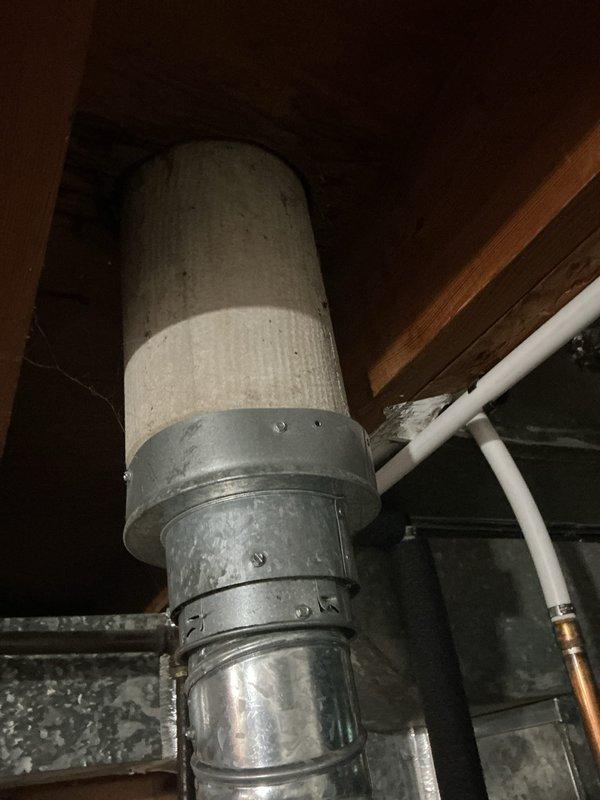 Completed water heater replacement estimate for residential property. Documented existing Richmond 40-gallon natural gas water heater with 10-year limited warranty on tank and parts, model RMG05NAT-40T, 40,000 BTU input rating. Inspected installation including venting system with insulated ductwork in attic space, metallic connectors, and associated PVC and copper plumbing lines. Photographed current equipment specifications, safety labels, and mechanical room configuration to provide accurate replacement recommendations and ensure proper sizing for future installation.