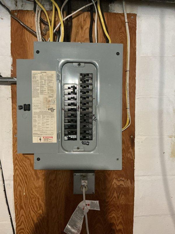 Completed comprehensive electrical club inspection of residential service panel and distribution system. Documented panel configuration showing dual-column circuit breaker arrangement with proper wire management, verified all circuit connections and conductor routing from main service entrance, and photographed panel labeling and safety compliance features for client records.