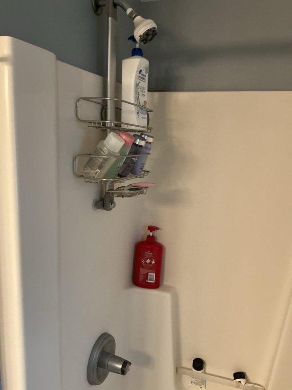 Responded to service call for leaky tub drain. Upon inspection, assessed all visible plumbing fixtures including shower arm assembly, tub spout with diverter, and drain cover. Completed necessary repairs to resolve the leak issue and restored proper drainage function. Documented existing fixture conditions and verified all components were operating correctly upon completion.