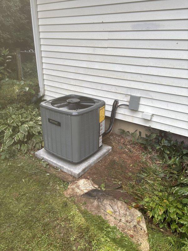 Completed full HVAC system replacement including installation of new Daikin furnace in basement mechanical room with updated white PVC venting and condensate drainage, connected to new air handler unit via flexible ductwork. Installed new outdoor condenser unit on concrete pad against exterior wall with proper electrical disconnect, conduit routing, and refrigerant line connections. All components tested and operational, system commissioned and ready for service.