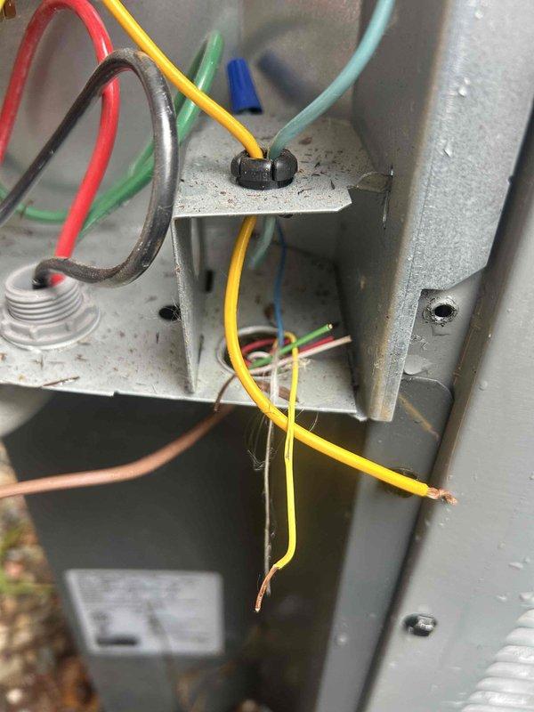 Completed annual cooling maintenance and tune-up on residential air conditioning system. Performed comprehensive inspection of electrical control panel, verifying all low-voltage wiring connections, terminal blocks, and control components for proper operation and safety. Documented electrical panel condition with detailed photographs showing wire routing, connections, and component placement for service records.