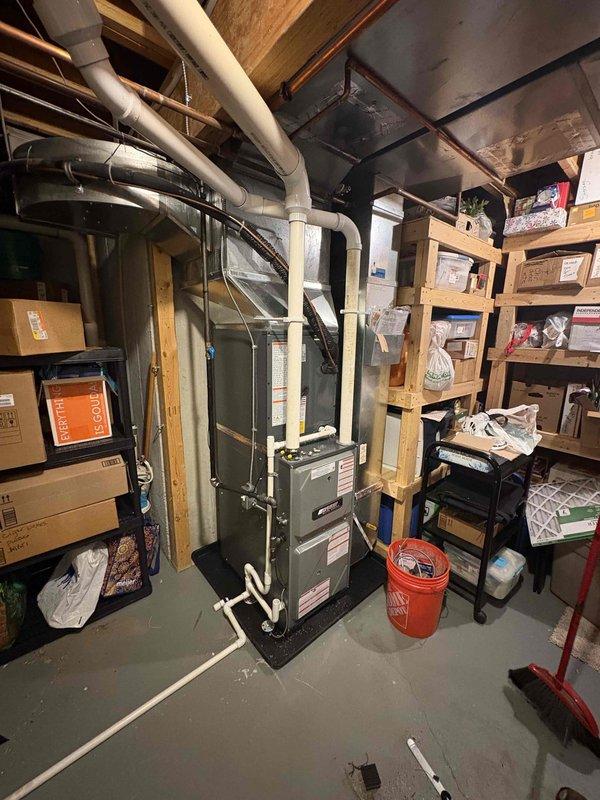 Completed full HVAC system installation in basement utility area, including new furnace unit and air conditioning system. Installed all necessary ductwork, white PVC venting pipes, and refrigerant lines according to manufacturer specifications and local building codes. Positioned equipment on protective mat, established proper clearances for service access, connected all electrical components, and verified system operation. All components tested and confirmed operational upon completion of installation.