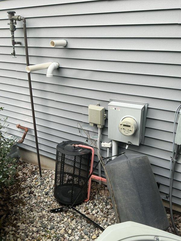 Conducted on-site assessment for dehumidifier and Energy Recovery Ventilator (ERV) installation at residential property. Evaluated existing exterior utility infrastructure including electrical service panel, meter location, and available mounting space on vinyl-sided exterior wall to determine optimal equipment placement and integration requirements for proposed indoor air quality system upgrade.