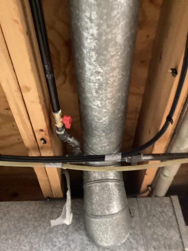 Installed new gas line routing to outdoor grill location through basement utility area. Ran black iron pipe from existing gas supply, securing line to ceiling joists with appropriate hangers and brackets alongside existing ductwork and electrical conduit. Completed installation with proper valve placement and pressure testing to ensure leak-free operation and code compliance.