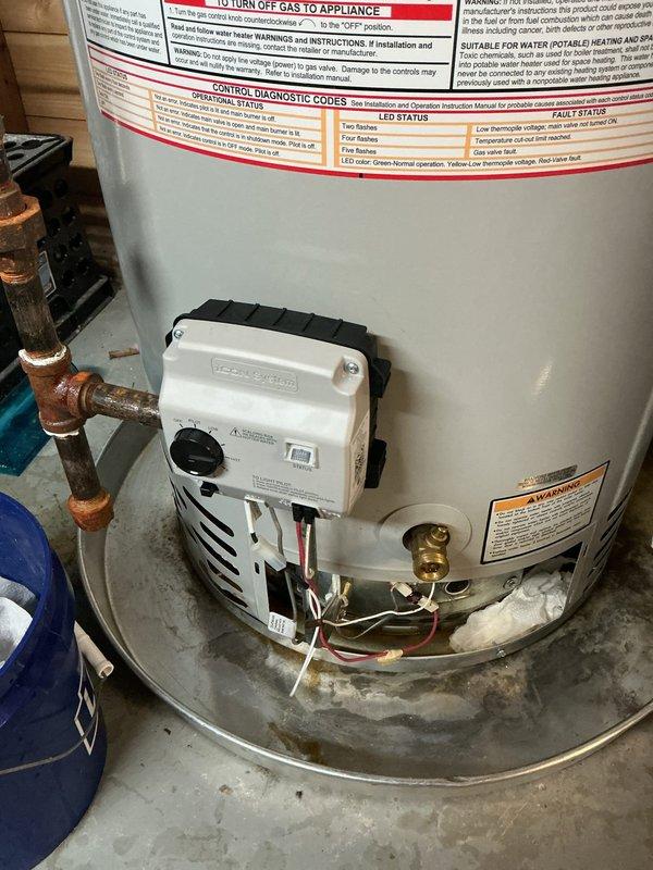 Responded to water heater pilot light issue on 5-year-old residential unit. Customer reported pilot would not stay lit after relighting, with flashing red LED indicator on gas valve control module. Inspected Honeywell gas valve assembly and burner chamber, examined flame sensor and thermocouple connections for proper seating and corrosion. Diagnosed faulty flame sensor preventing pilot safety circuit from maintaining gas flow. Cleaned flame sensor rod, verified proper grounding, and tested gas valve operation through multiple ignition cycles to confirm pilot stability and main burner function restored.