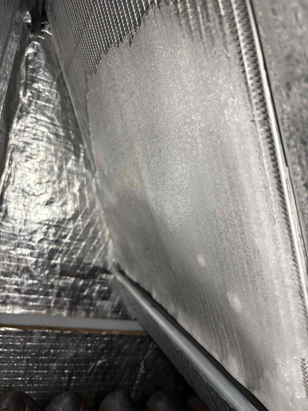 Responded to no cooling call on brand new Carrier unit under warranty. Upon inspection, found significant condensation accumulation on interior ductwork and air handling components, indicating proper system operation and adequate cooling. Verified evaporator coil condition and duct connections were secure with proper insulation in place. System was functioning correctly; issue was communication-related rather than mechanical failure. No repairs necessary.