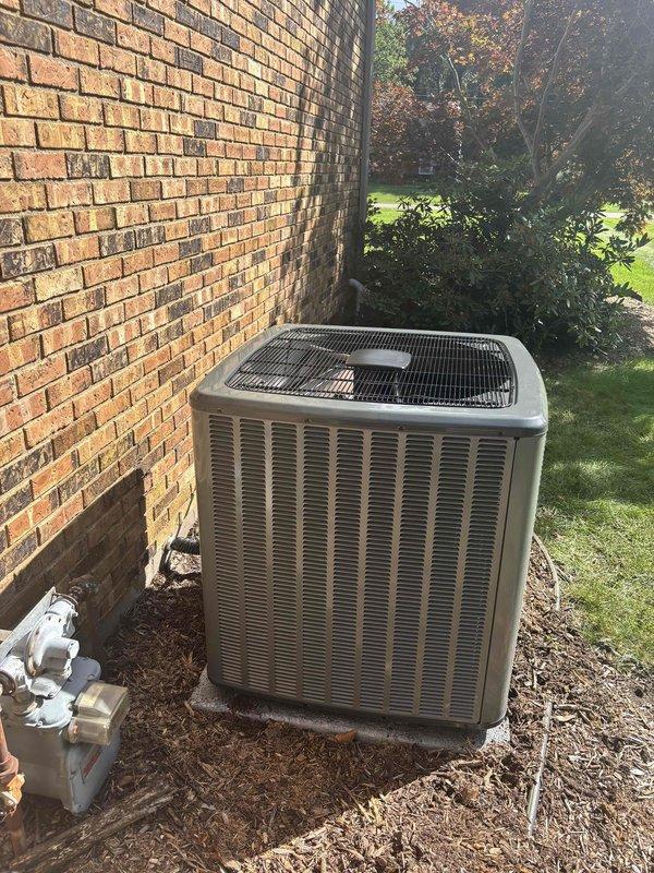 Completed full residential HVAC system installation including new furnace and air conditioning condenser unit. Installed outdoor AC condenser on concrete pad against exterior brick wall with proper clearances, connected refrigerant lines, installed electrical disconnect box with conduit, and completed all necessary piping connections. System tested and verified operational upon completion.